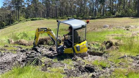 can a mini excavator get stuck|excavator stuck in mud.